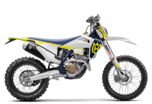 Das Bild zeigt ein Husqvarna Motocross-Motorrad mit modernem Design und robusten Reifen, ideal für Offroad-Abenteuer.