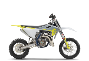 Husqvarna TC 125 Motocross-Motorrad in modernem Design mit gelben Akzenten und leistungsstarkem Motor.