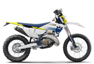 Das Bild zeigt ein modernes Husqvarna Motocross-Motorrad in Weiß und Blau, ideal für Offroad-Abenteuer.